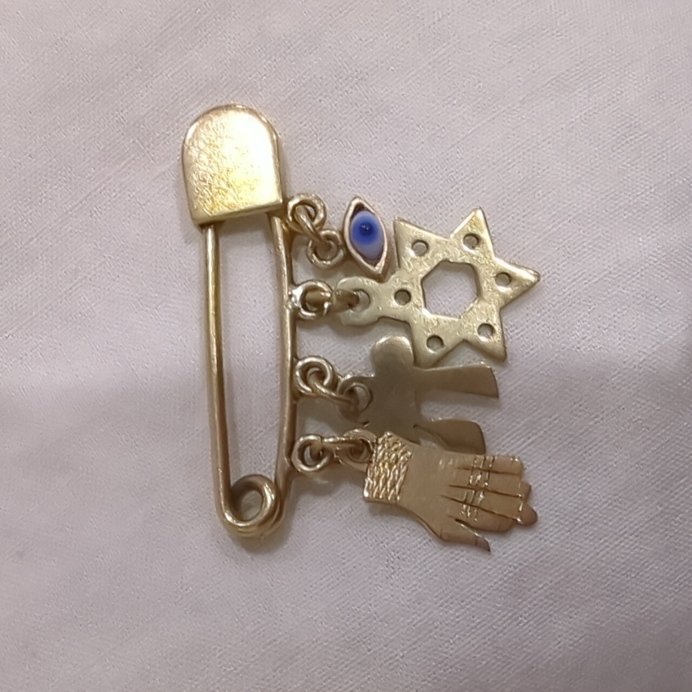 Gold Charm Brooch with Hand, Star, and Eye Accents